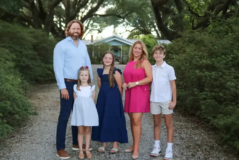 Breigh and Adam Rhodes with their three children, at home in Prairieville