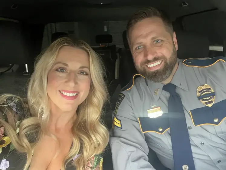 Breigh with her husband Adam, in uniform