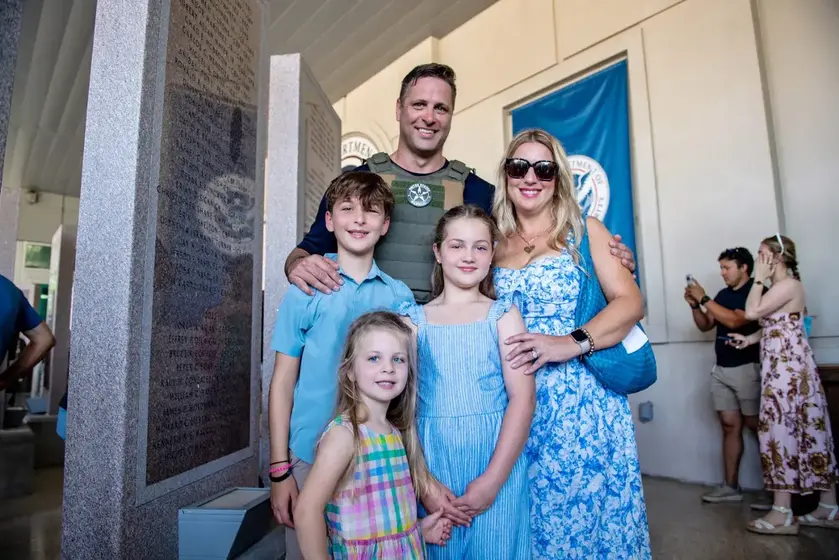 Breigh, Adam and their three children at a law enforcement ceremony